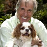 Henry Winkler holding a Cavalier King Charles Spaniel