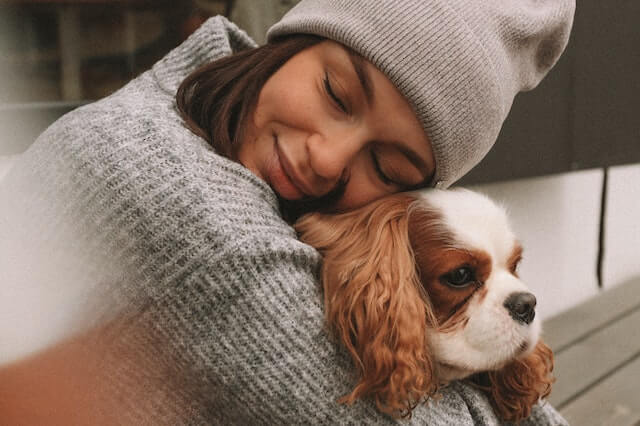 cavalier cuddling with a woman